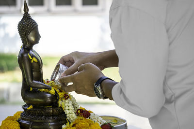 Close-up of human statue against temple