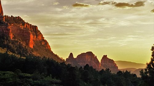 Idyllic view of mountains against sky during sunset