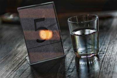 Close-up of beer glass on table