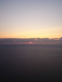 Scenic view of sea against clear sky during sunset