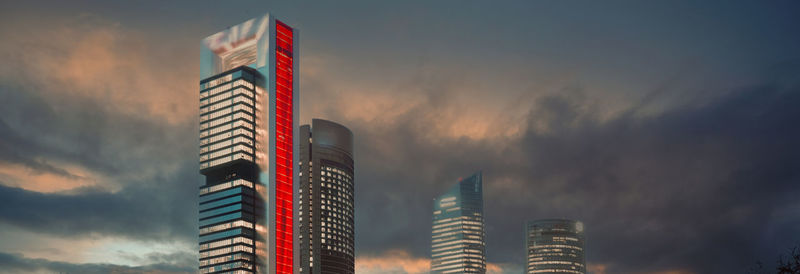 Low angle view of buildings against sky during sunset