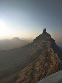 Scenic view of landscape against clear sky during sunset