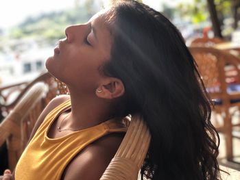 Portrait of a young woman looking away