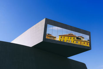 LOW ANGLE VIEW OF INFORMATION SIGN AGAINST CLEAR SKY