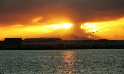 Scenic view of sea against sky during sunset