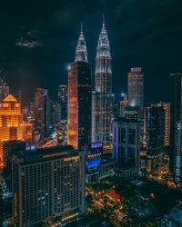 Illuminated buildings in city at night