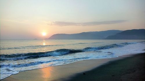 Scenic view of beach during sunset