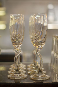 Close-up of wine glasses on table