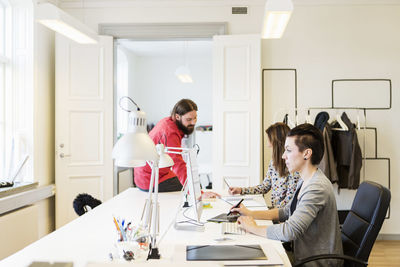 Business people working at desk in creative office