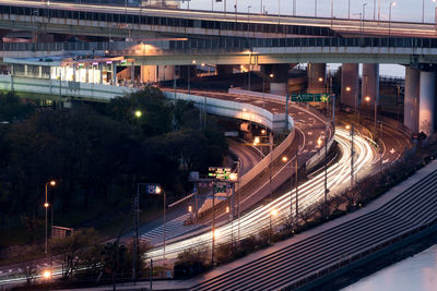 High angle view of light trails on road at night