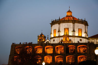 Low angle view of illuminated monastery of serra do pilar against clear sky