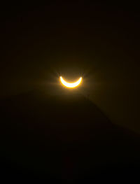 Scenic view of silhouette moon against sky at night