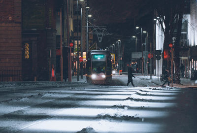 Cars on street in winter at night