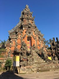 Low angle view of temple against building