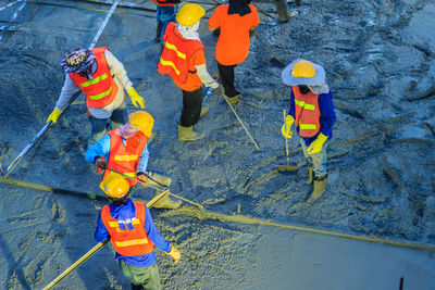 High angle view of people working in water