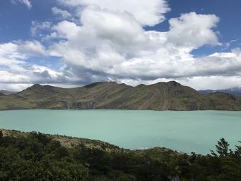 Scenic view of lake and mountains against sky