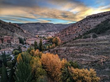 Panoramic shot of townscape against sky during sunset