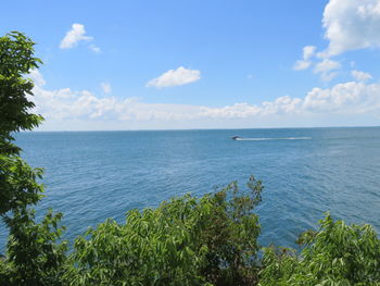 Scenic view of sea against cloudy sky