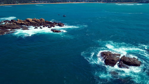 High angle view of rock in sea