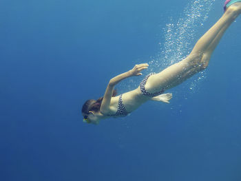 Girl swimming in sea