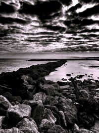 Scenic view of sea against cloudy sky