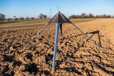 Scenic view of agricultural field against clear sky