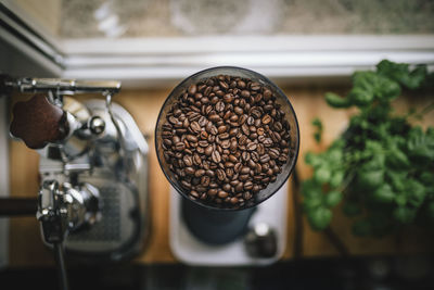 Directly above shot of coffee beans in machinery