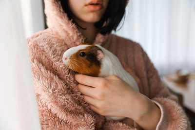 Portrait of young woman with dog