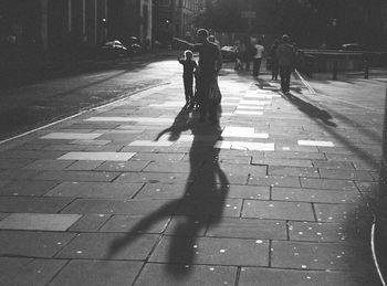 Shadow of people on road