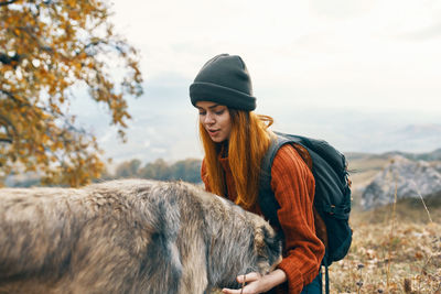 Young man with horse in winter