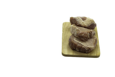 Close-up of bread against white background