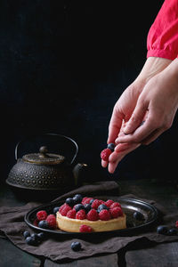 Cropped hands preparing food in home