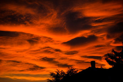 Low angle view of dramatic sky during sunset