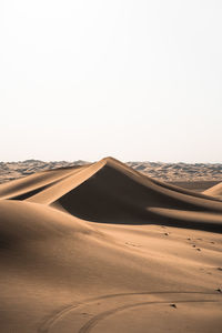 Scenic view of desert against clear sky