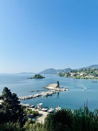 Scenic view of sea against clear blue sky