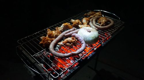 High angle view of meat on barbecue grill