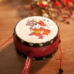 High angle view of rattle drum on wooden table