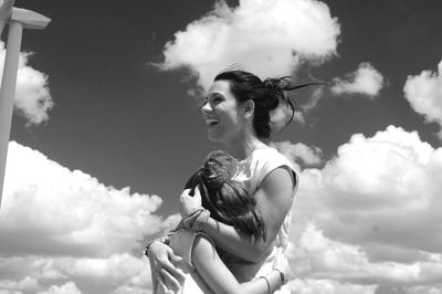 Low angle view of woman against sky