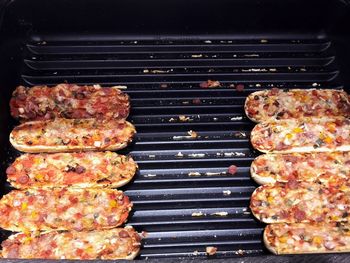 High angle view of meat on barbecue grill