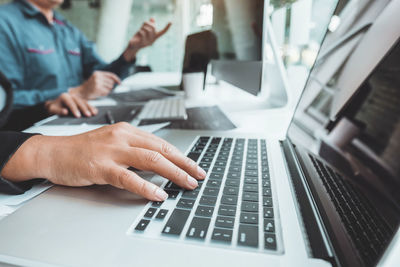 Low angle view of man working on table