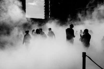 Panoramic view of people against sky