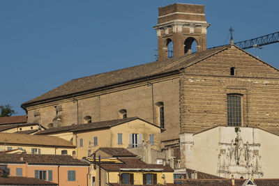 Low angle view of buildings against clear sky