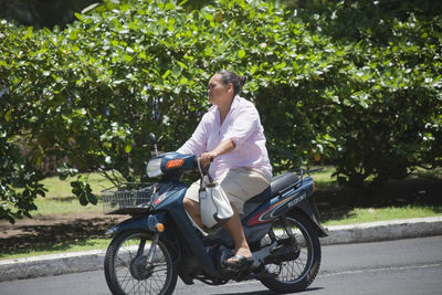 Man riding bicycle on road