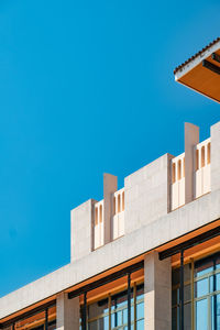 Low angle view of building against clear blue sky