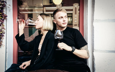 Portrait of young couple holding hands