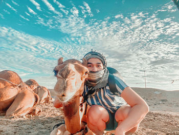 Man with camel at desert 