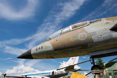 Low angle view of airplane against sky