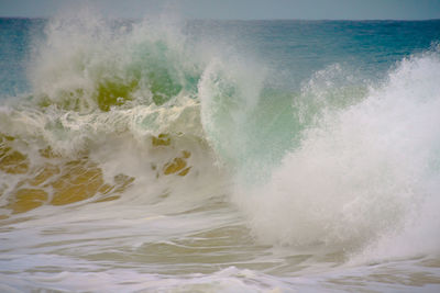 Waves splashing on rocks