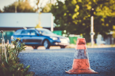 Close-up of vintage car on road in city