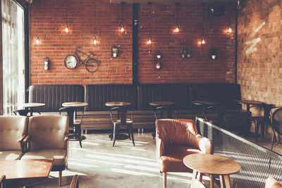 Empty chairs and tables in cafe